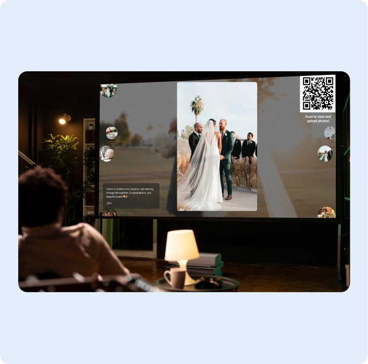 Guest book photos playing on a TV screen at a reception
