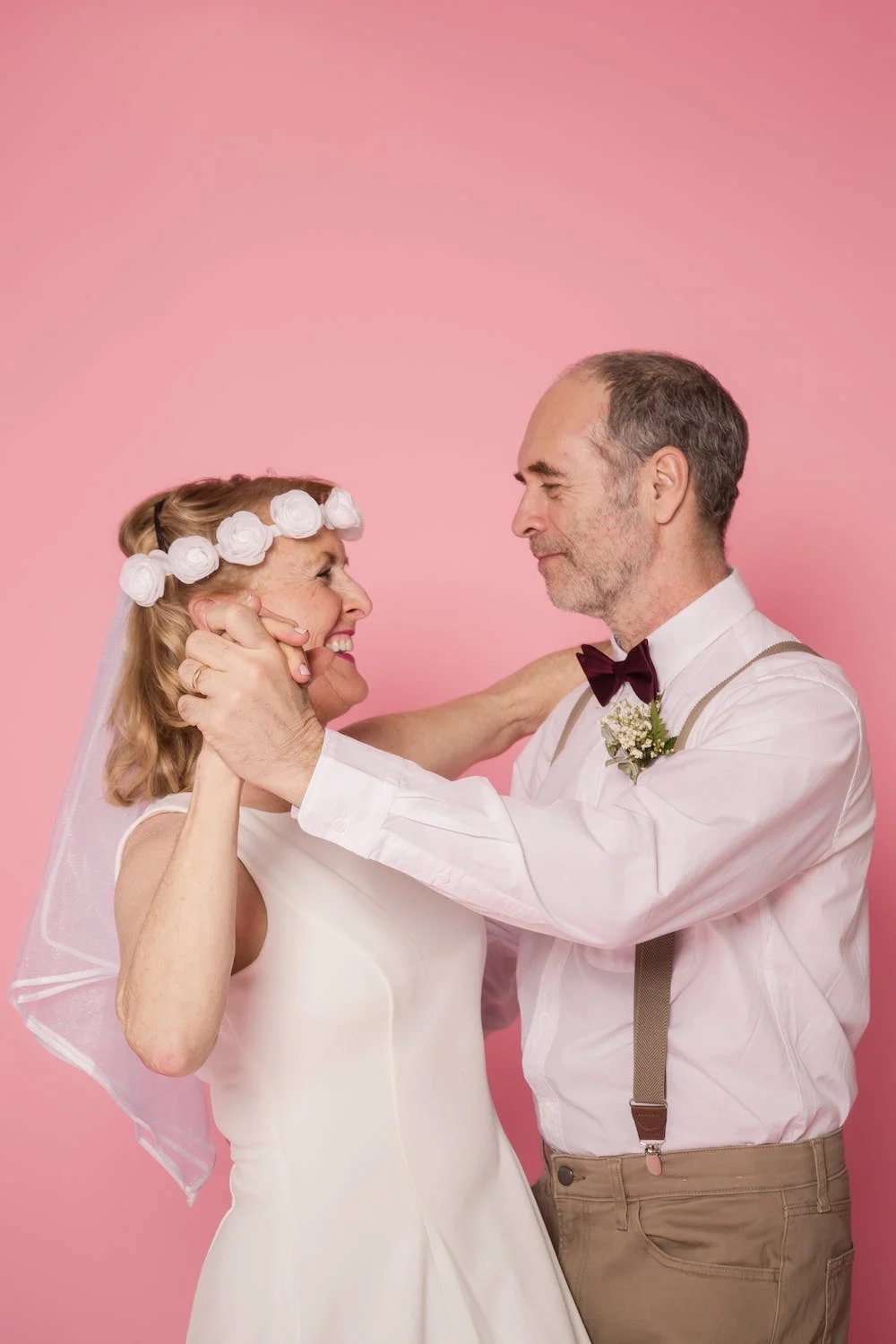 Bride and groom dancing, the bride wearing a flower crown